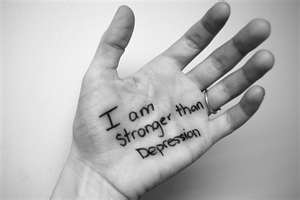 Left hand with writing: I am stronger than Depression