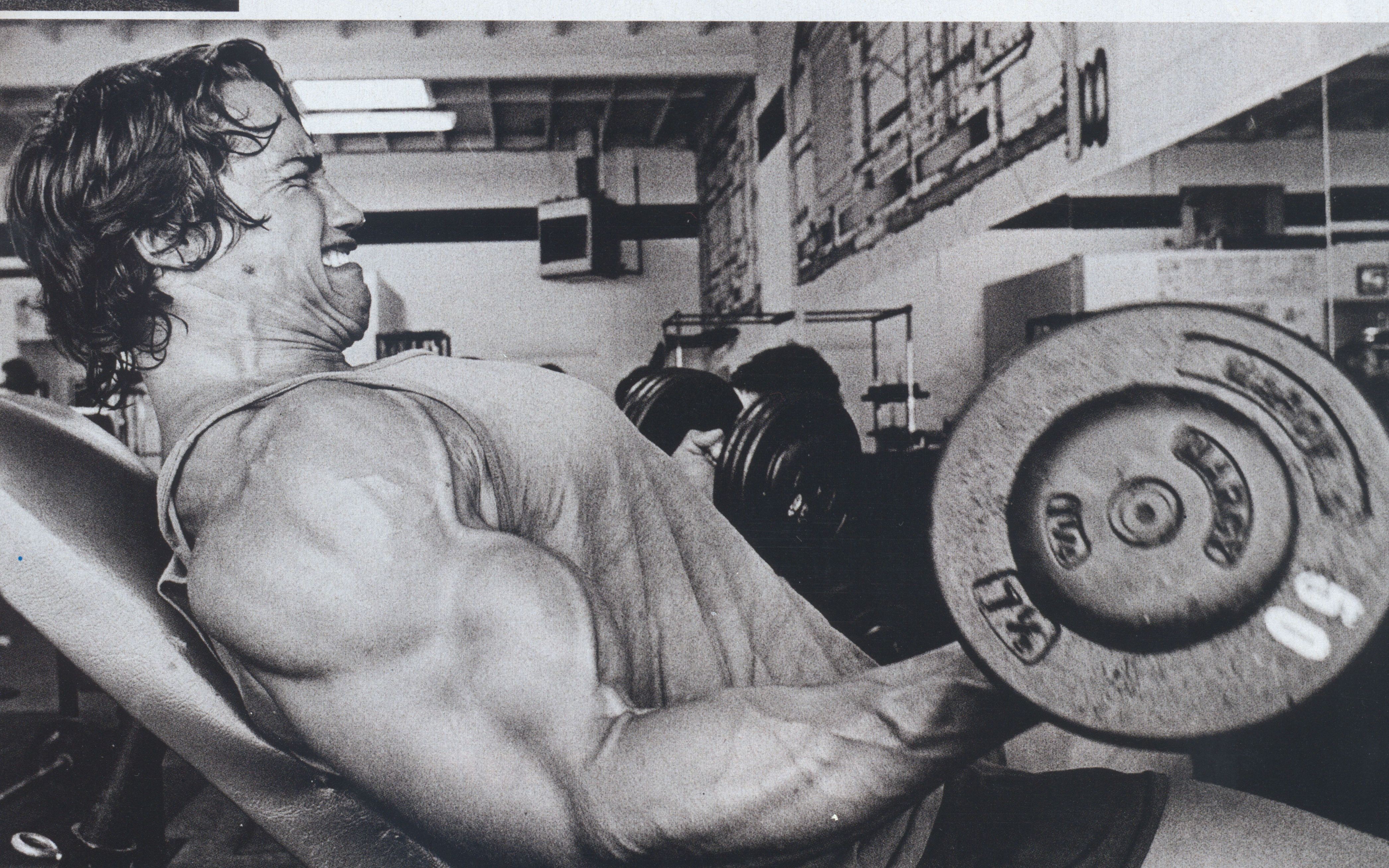 Arnold Schwarzenegger lifting weights