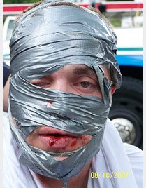 Man's face covered in duct tape