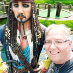 Bob Scharn standing with statue of Captain Jack Sparrow